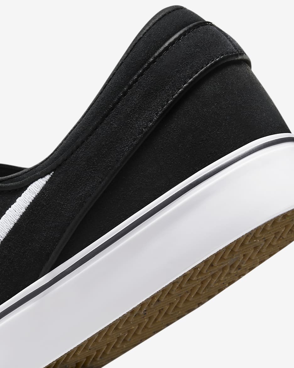 Nike sb janoski slip on black and white hotsell